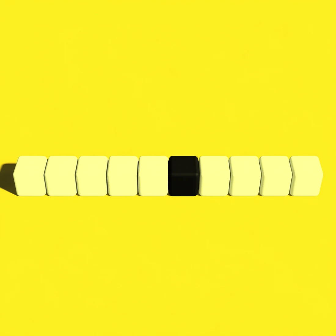 A row of white cubes with one black cube among them